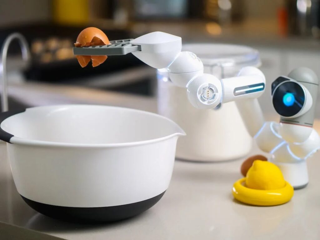 a robot cracking an egg in a bowl